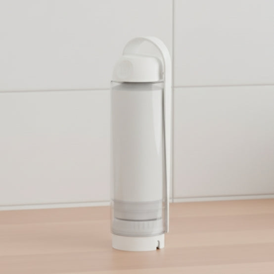 White koor refillable bottle on a light wooden surface with a white tiled wall background